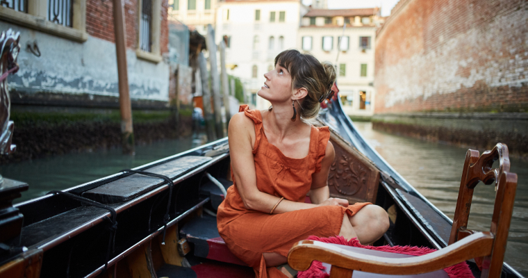 A woman in a gondola in Venice