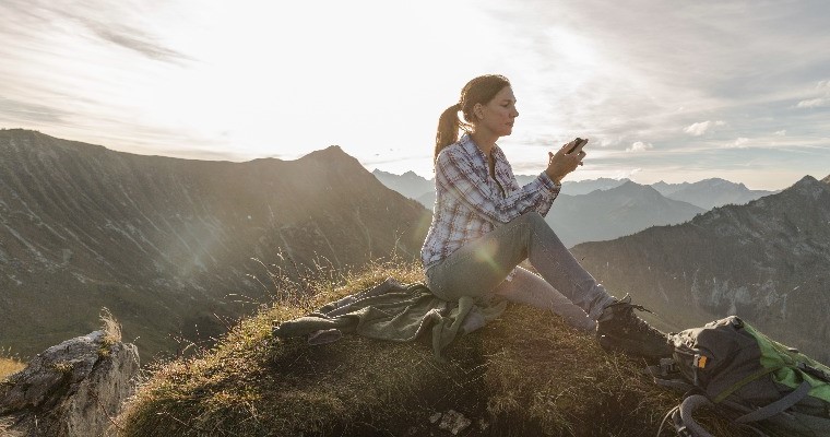 A woman sitting on a mountain