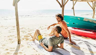 Two men relaxing on a beach