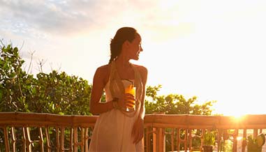 Woman enjoying the weather with a drink