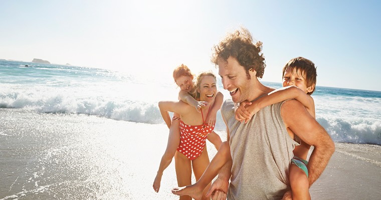 Family playing at the beach